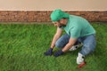 Worker laying grass sod at backyard Royalty Free Stock Photo