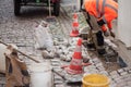 worker laying of old paving stones Royalty Free Stock Photo