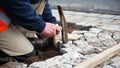 Worker laying paving stones