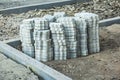 worker laying paving stones. stone pavement, construction worker laying cobblestone rocks on sand. Royalty Free Stock Photo