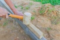 Worker laying red and gray concrete paving blocks. Road Paving, construction Royalty Free Stock Photo