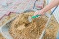 Worker laying red and gray concrete paving blocks. Road Paving, construction Royalty Free Stock Photo