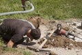 Worker worker laying tupo for the electrical and hydraulic connection