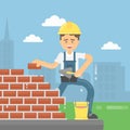 Worker lays bricks.