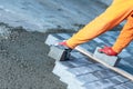 A worker lays paving stones Royalty Free Stock Photo