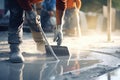 Worker leveling concrete floor with shovel at construction site, closeup, Construction worker use screed concrete epoxy for level