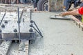 Worker is leveling concrete after pouring Royalty Free Stock Photo
