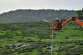 Municipal worker man with helmet and safety protective equipment installs new diode lights