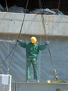 Worker with lifting ropes Royalty Free Stock Photo