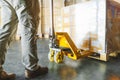 Worker loading cargo shipment pallet goods at warehouse storage. Royalty Free Stock Photo