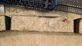 Worker loads sawdust in the car at a woodworking factory