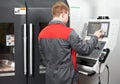 Worker at machining tool workshop