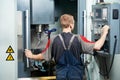 Worker at machining tool workshop