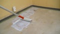 Worker making apartment renovation. Male specialist processing concrete in new apartment. Home improvement concept. The process of