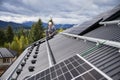 Worker making measurements to secure the solar panel well