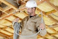 worker making mounting for electric cable in ceiling Royalty Free Stock Photo