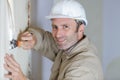 Worker making repair in room Royalty Free Stock Photo