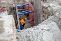 Worker making trench bed for new pipeline construction Royalty Free Stock Photo