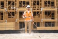 Worker man on the building construction. Construction site worker in helmet work outdoors. Builder in helmet on coffee Royalty Free Stock Photo