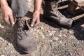 Worker man closing her shoes. Royalty Free Stock Photo