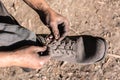 Worker man closing her shoes. Royalty Free Stock Photo