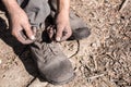 Worker man closing her shoes. Royalty Free Stock Photo