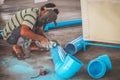 Worker man cutting PVC pipe with Grinding machine ,