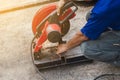 Worker man cutting steel with a circular steel cutter Royalty Free Stock Photo