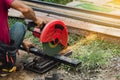 Worker man cutting steel with a circular steel cutter Royalty Free Stock Photo