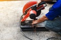 Worker man cutting steel with a circular steel cutter Royalty Free Stock Photo