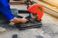 Worker man cutting steel with a circular steel cutter Royalty Free Stock Photo