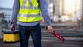 Worker man holding spirit level tool and box Royalty Free Stock Photo