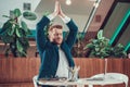 Worker man meditating at desk in office. Royalty Free Stock Photo