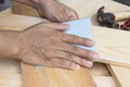 Worker Man Polishing Sandpaper Wood