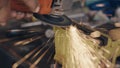 Worker man using electric wheel tool grinding and cutting on steel structure Royalty Free Stock Photo