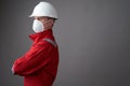 Worker man wearing hygienic mask, overall and protective hard hat Royalty Free Stock Photo