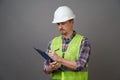 Worker man wearing protective hard hat and reflective vest