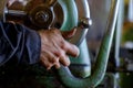 Worker manipulate old machine on factory Royalty Free Stock Photo