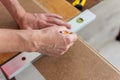 Worker marks the length of the laminate Royalty Free Stock Photo