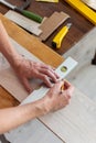 Worker marks the length of the laminate Royalty Free Stock Photo