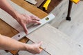 Worker marks the length of the laminate Royalty Free Stock Photo