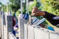 Worker masonry are building walls with cement blocks and mortar