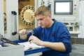 Worker measuring detail Royalty Free Stock Photo