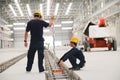 Worker measuring water level of structure job