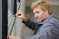 worker measuring window at construction site Royalty Free Stock Photo