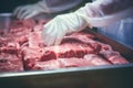 Worker at the meat factory pack the meat into the plastic foil. Generative AI