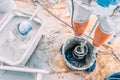 Worker mixing concrete in bucket Royalty Free Stock Photo