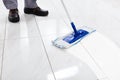 Worker Mopping Floor