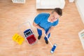 Worker Mopping Wooden Floor