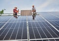Worker mounting photovoltaic solar panel system Royalty Free Stock Photo